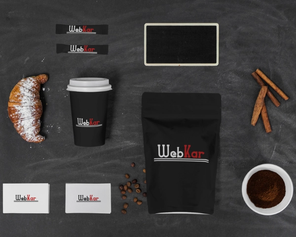 Branded business materials including packaging, coffee cup and business cards
